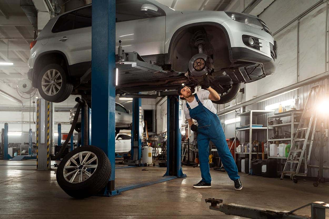 What is included in a Multi-Point Inspection? | Stetler DCJR in York, PA | Mechanic inspecting the suspension on vehicle