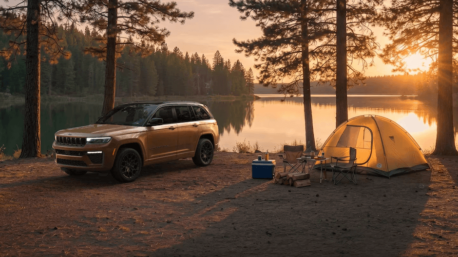 A 2027 Jeep Grand Cherokee parked at a campsite