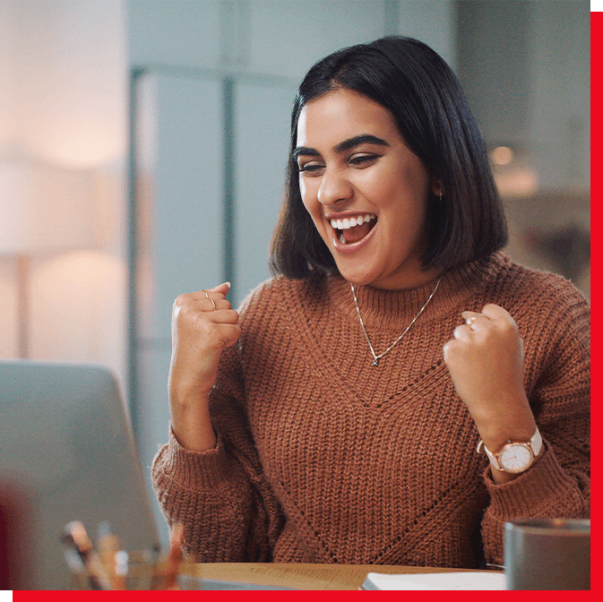 Women celebrating completing the Smartpath process on her laptop