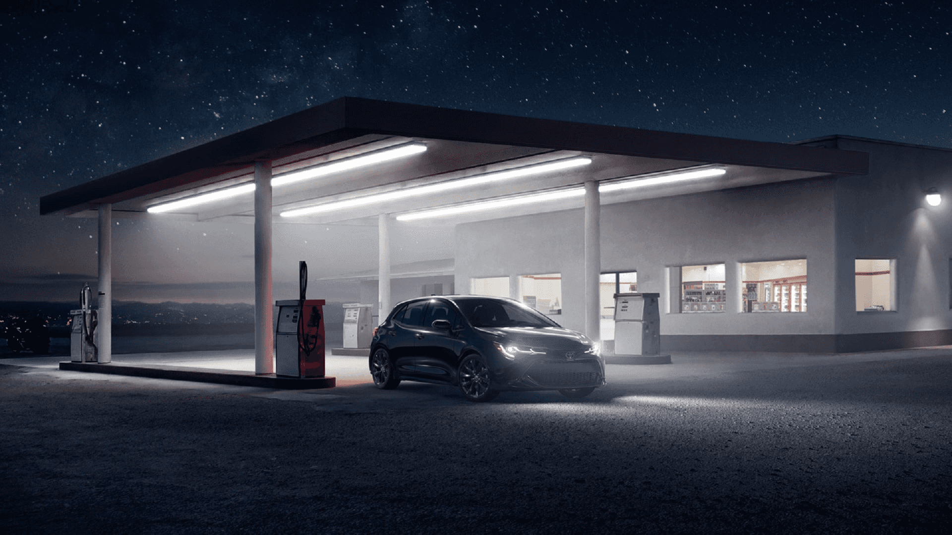 Toyota_Corolla_Hatchback_Parked_At_Gas_Station_Night
