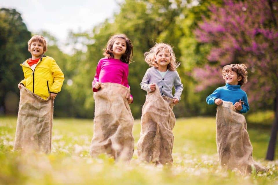Children have a sack race.