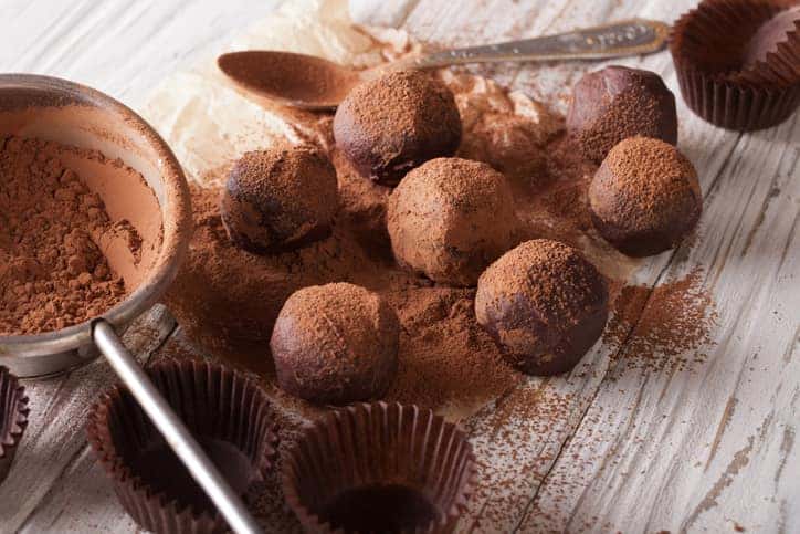 chocolate truffles sprinkled with cocoa powder