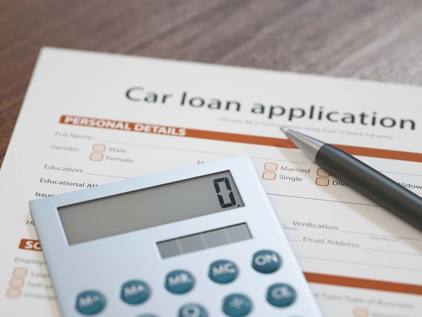 Car,Loan,Application,With,Pen,And,Calculator