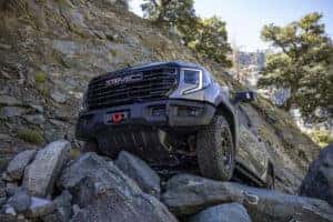 2023 GMC Sierra 1500 AT4X AEV Edition Maneuvering Over Rocks