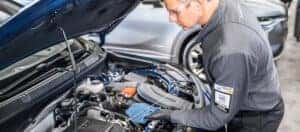 Buick Certified Technician checks the oil in a buick