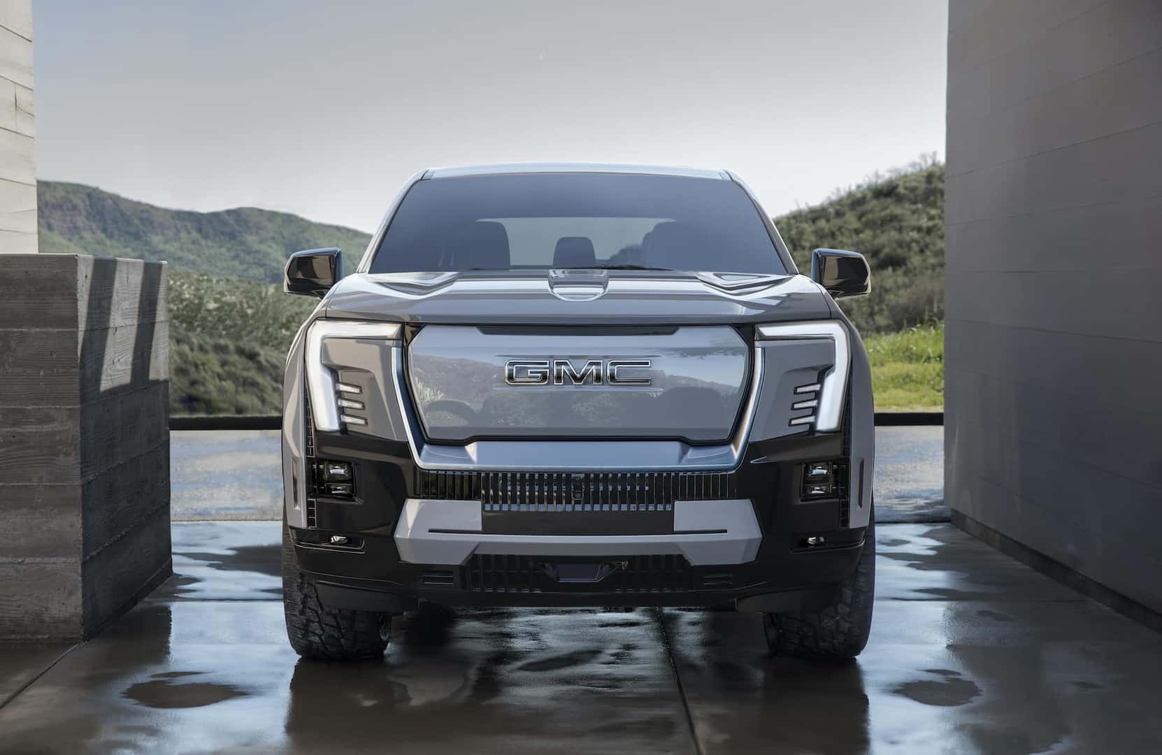 Bold and modern grille of the GMC Sierra EV Denali Edition 1 from a front view.