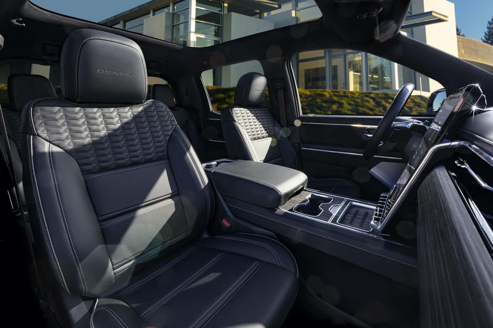 Interior shot of the 2024 GMC Sierra EV Denali Edition 1 showing its unique seating details and fixed glass roof.