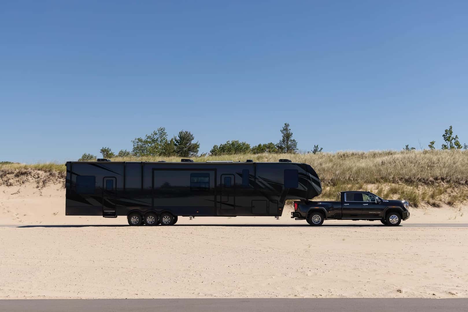 2025 GMC Sierra 3500HD Denali towing a fifth wheel