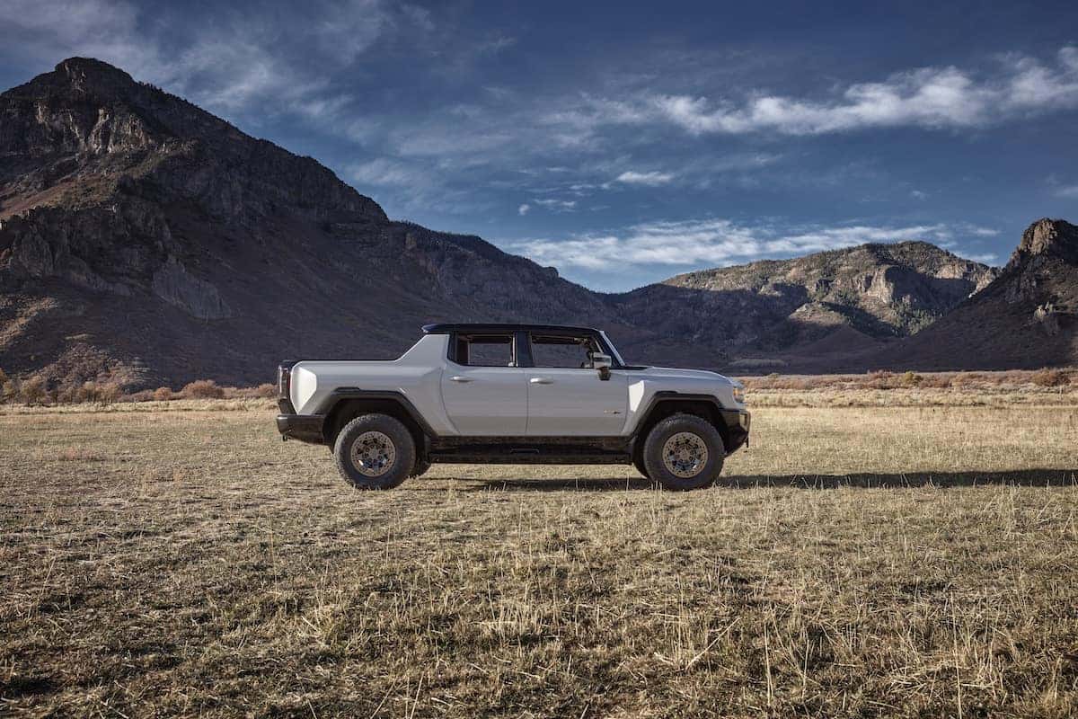 Side profile of the 2023 GMC HUMMER EV Edition 1 Pickup in the desert. The 2023 GMC HUMMER EV Edition 1 Pickup features next-generation EV propulsion technology to enable the ultimate off-road capability and on-road performance.