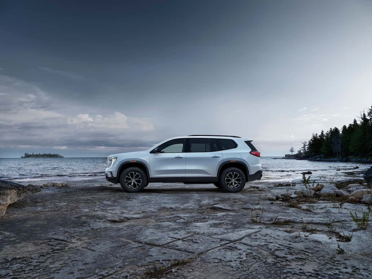 Wide angle side profile of the 2024 GMC Acadia AT4.