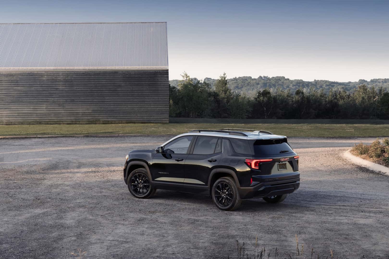 Rear 3/4 view of the next-generation 2025 GMC Terrain Elevation featuring two-tone roof.