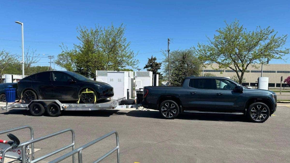 GMC Sierra EV towing a Tesla Model Y