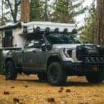 The Durable And Shiny 2025 GMC Sierra HD AT4X AEV Edition, Camping Out In The Middle Of A Forest