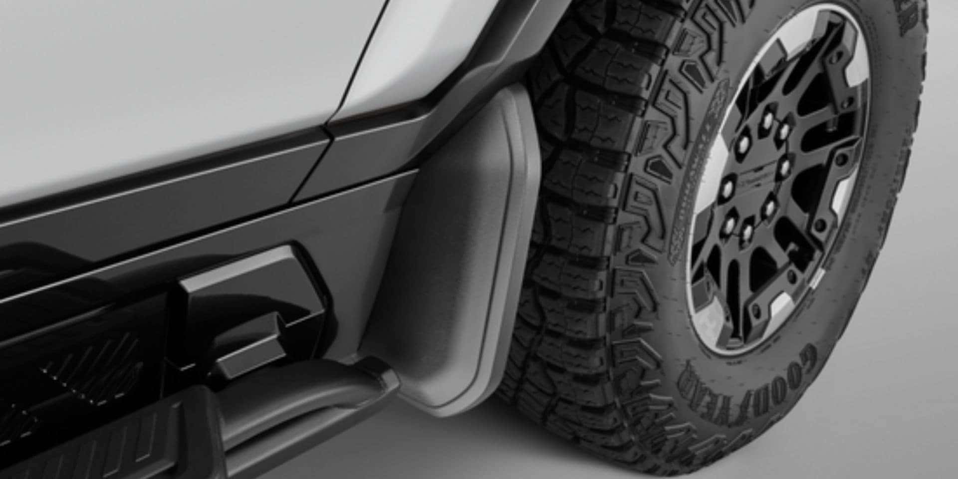 Splash guards on truck tires to reduce mud from camping trips. GMC accessory available at Valley GMC in Auburn.