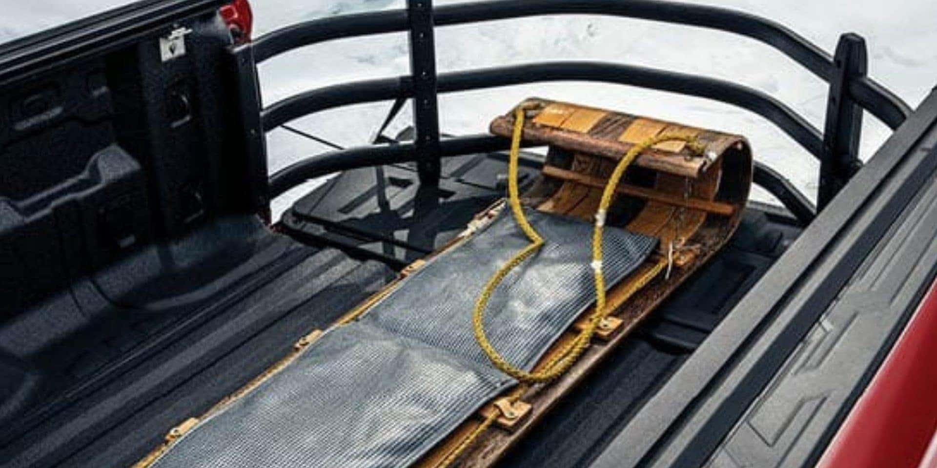 Bed extender in GMC Sierra helps haul long gear to the mountains for winter sports from valley gmc in auburn