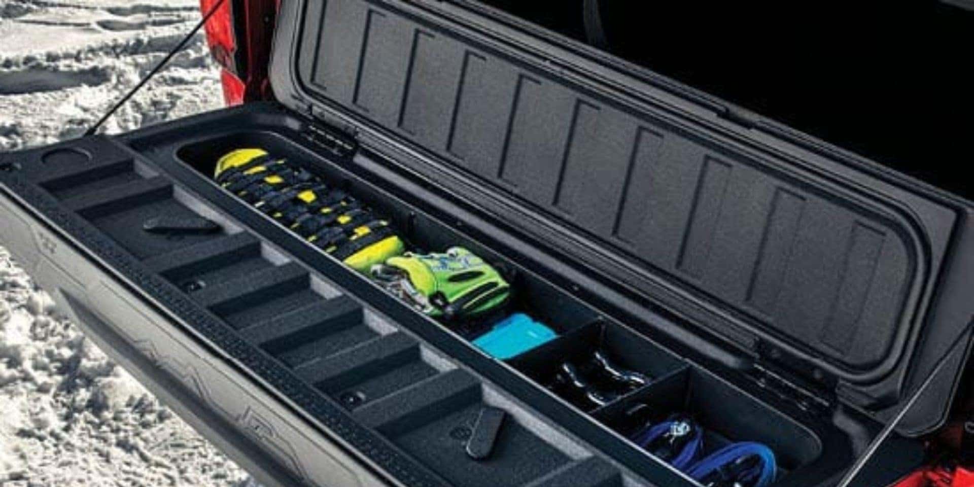 Secure gloves or other small items in a tailgate organizer in a GMC Sierra to make your winter sports easier from Valley GMC in Auburn.