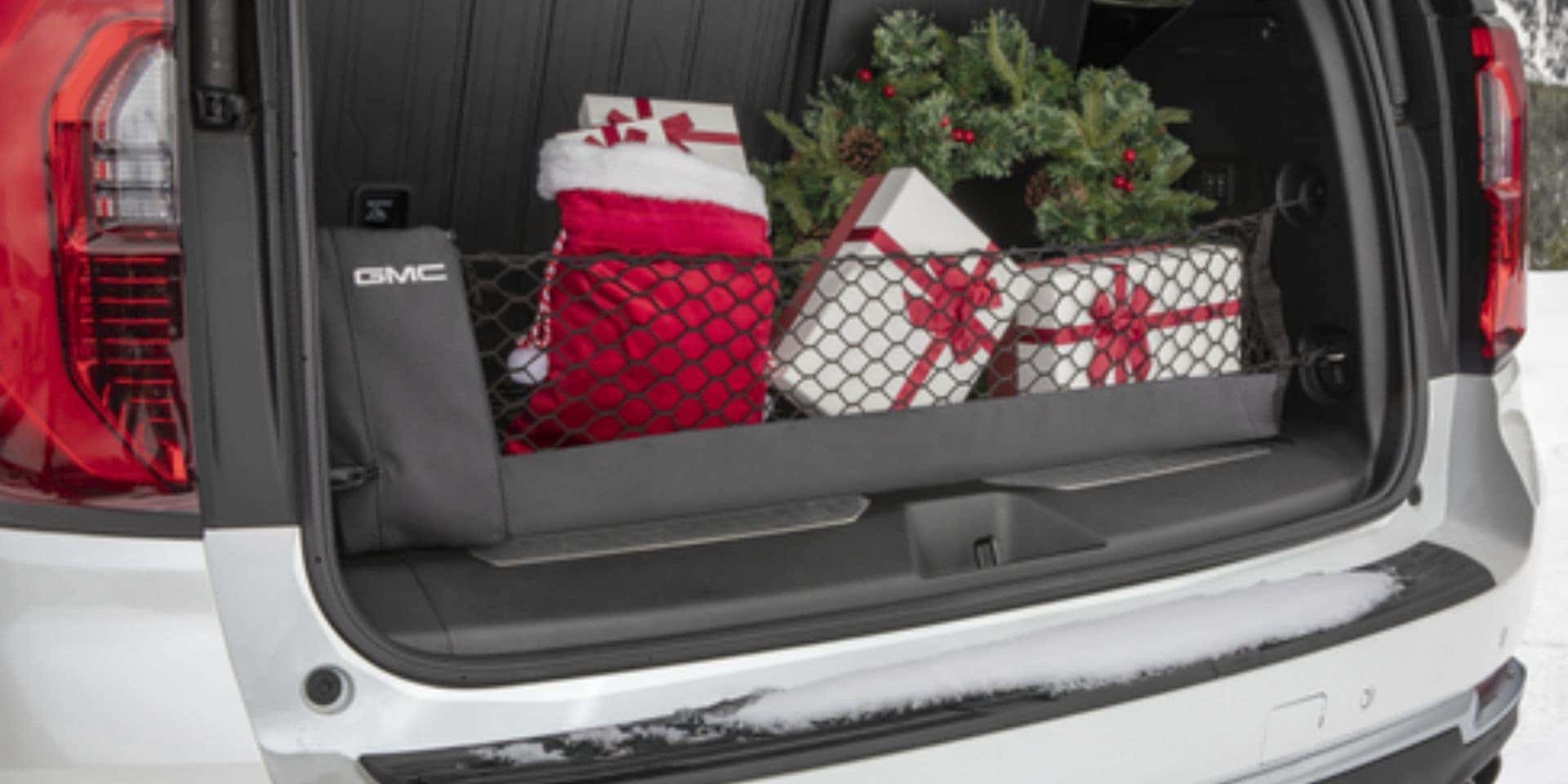 Cargo net organizing holiday gifts in the back of a GMC Acadia at Valley GMC in Auburn WA