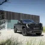 Black GMC Sierra 2500 HD Denali Ultimate parked in a house driveway