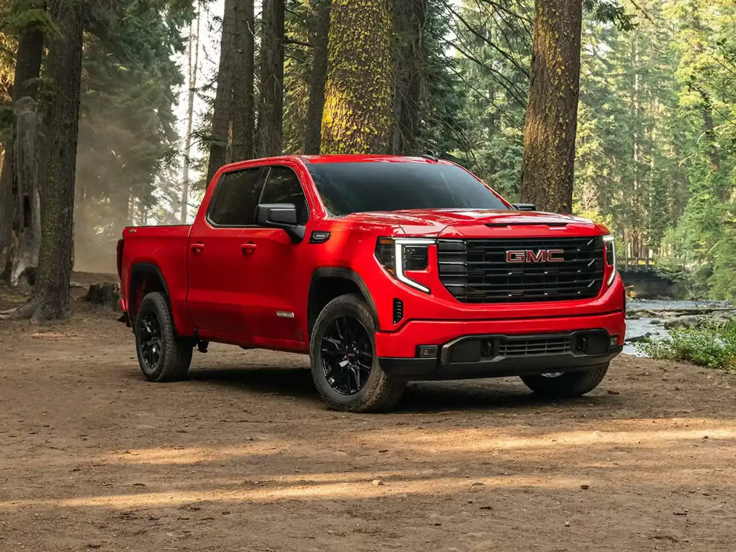 2026 GMC Sierra 1500 Pro red in the woods