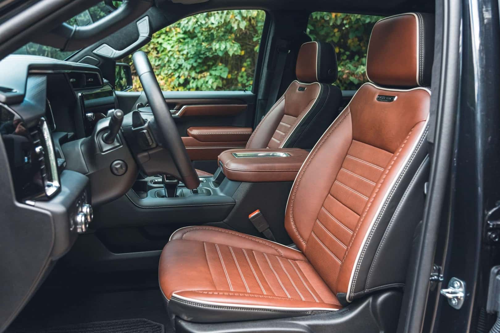 The Leather Upholstered Front Seats Of The Luxurious GMC Sierra 1500 Denali