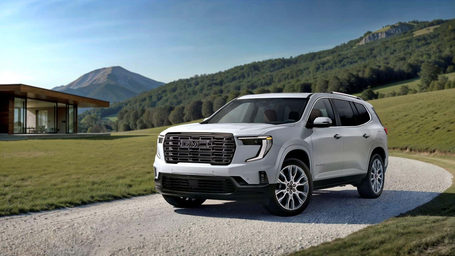 The Impressive 2026 GMC Acadia Denali Ultimate Driving Out Of The Winding Drive Way