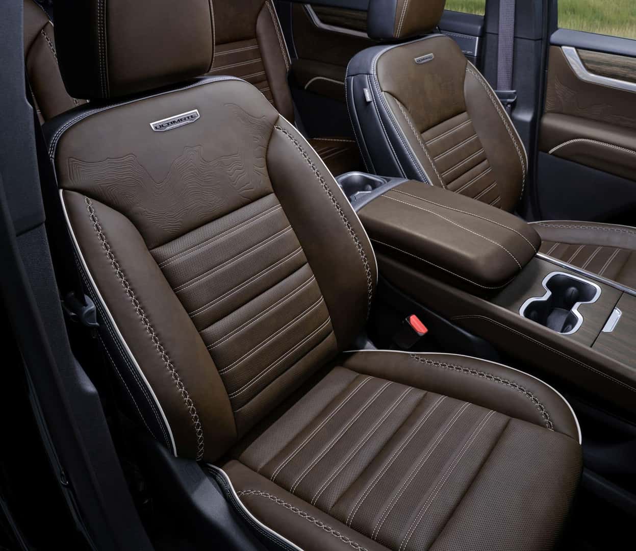 The Comfortably Cushioned Front Seats, Upholstered In Woodland Mahogany Leather