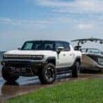 The Powerful 2023 GMC Hummer EV Towing A Boat Out Of The Water Successfully