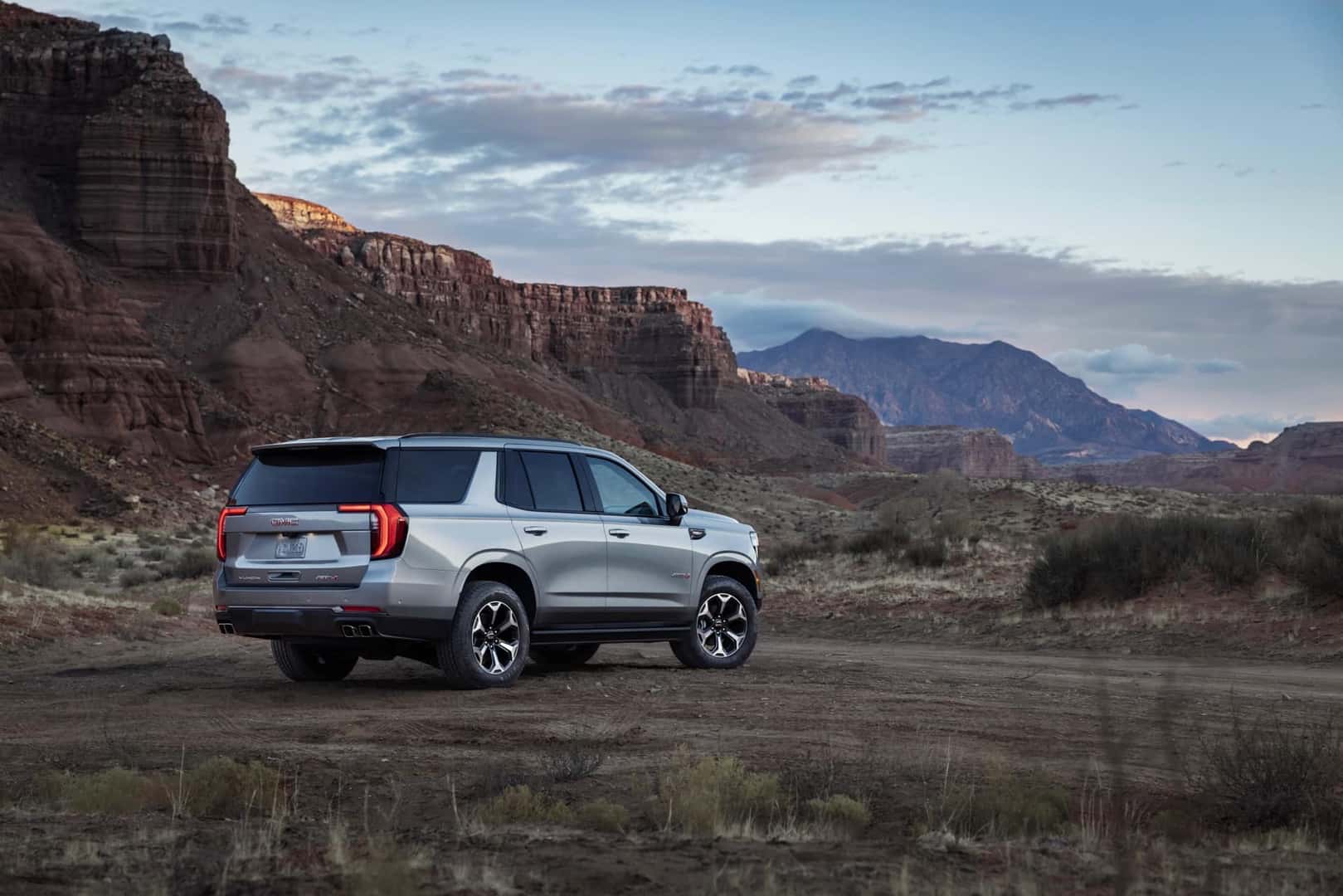 The Back Exterior Of The Award-Winning 2025 GMC Yukon AT4 Ultimate, Parked In Rocky Terrain