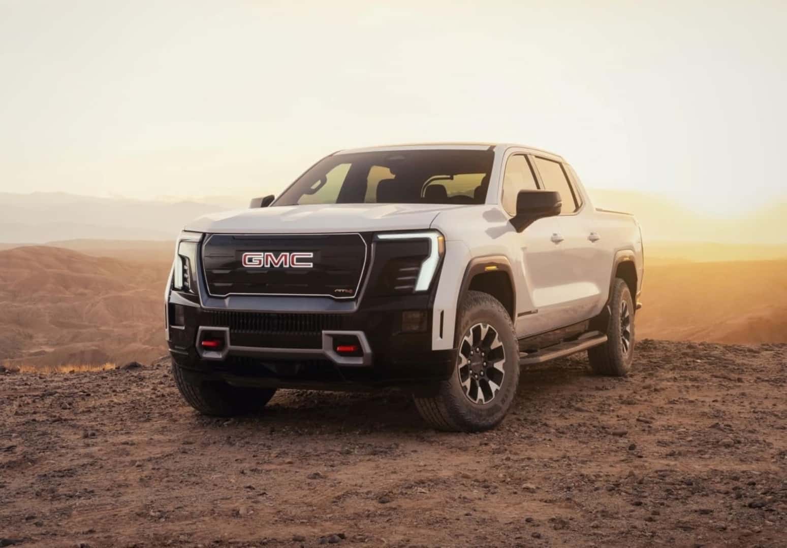 The Esteemed 2026 GMC Sierra EV AT4, Parked At The Edge Of A Dirty Cliff