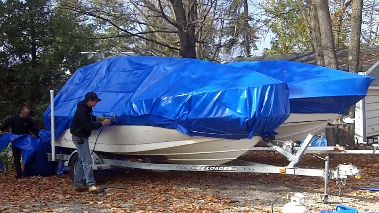 shrink wrapping a sailboat