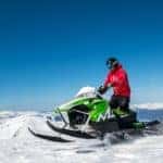 riding a snowmobile