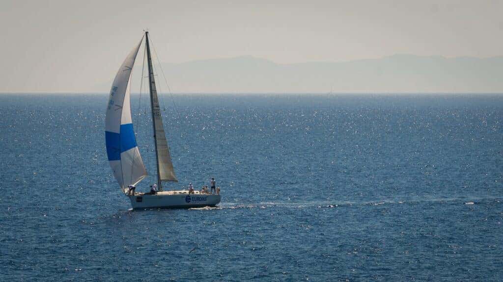 sailboat sailing on open water