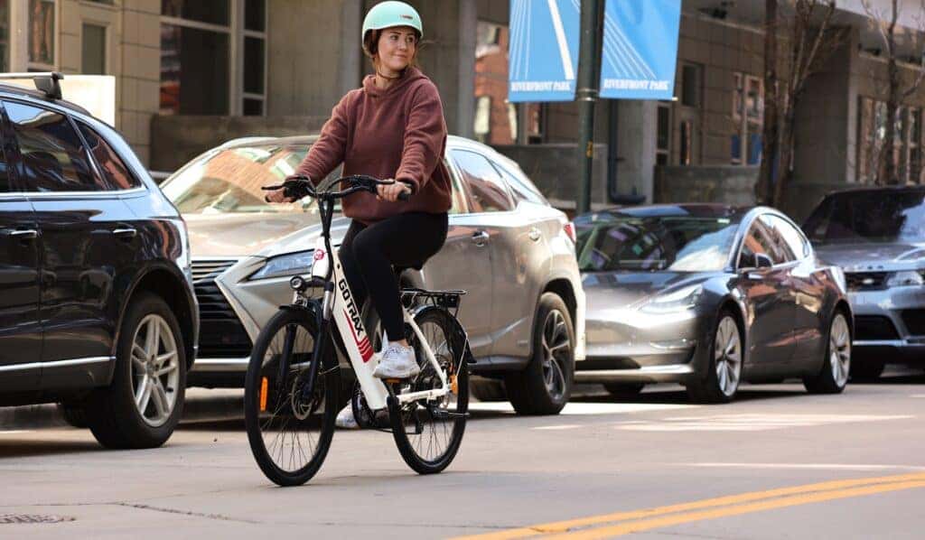 Person riding a white electric bike