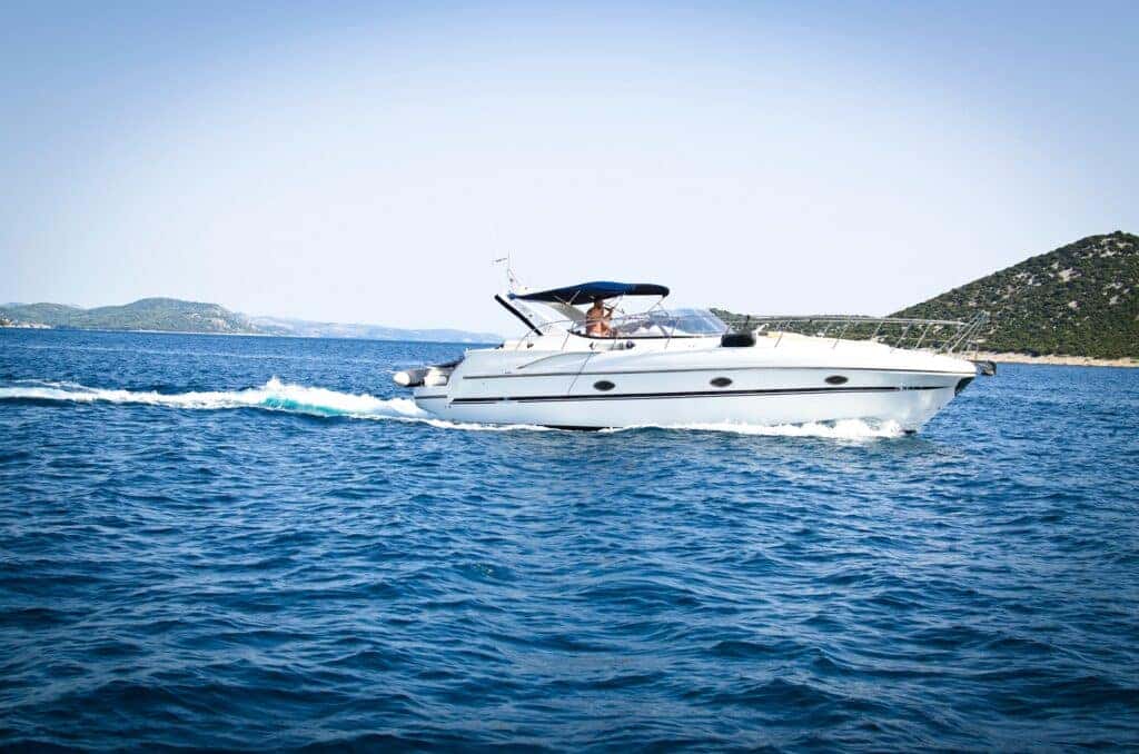 a person sitting on a powerboat