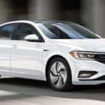 White Volkswagen Jetta Driving
